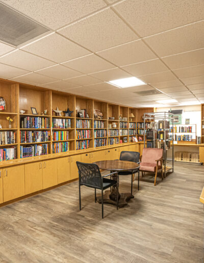 Interior common area with bookshelves and seating