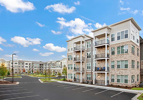Exterior view of a senior living facility with landscaped areas