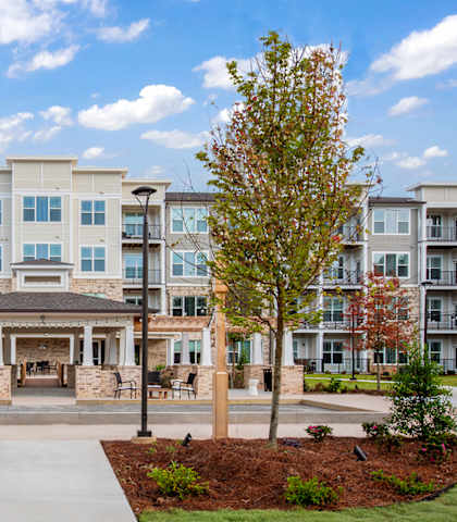 Exterior view of StonePointe Senior Living with landscaped area