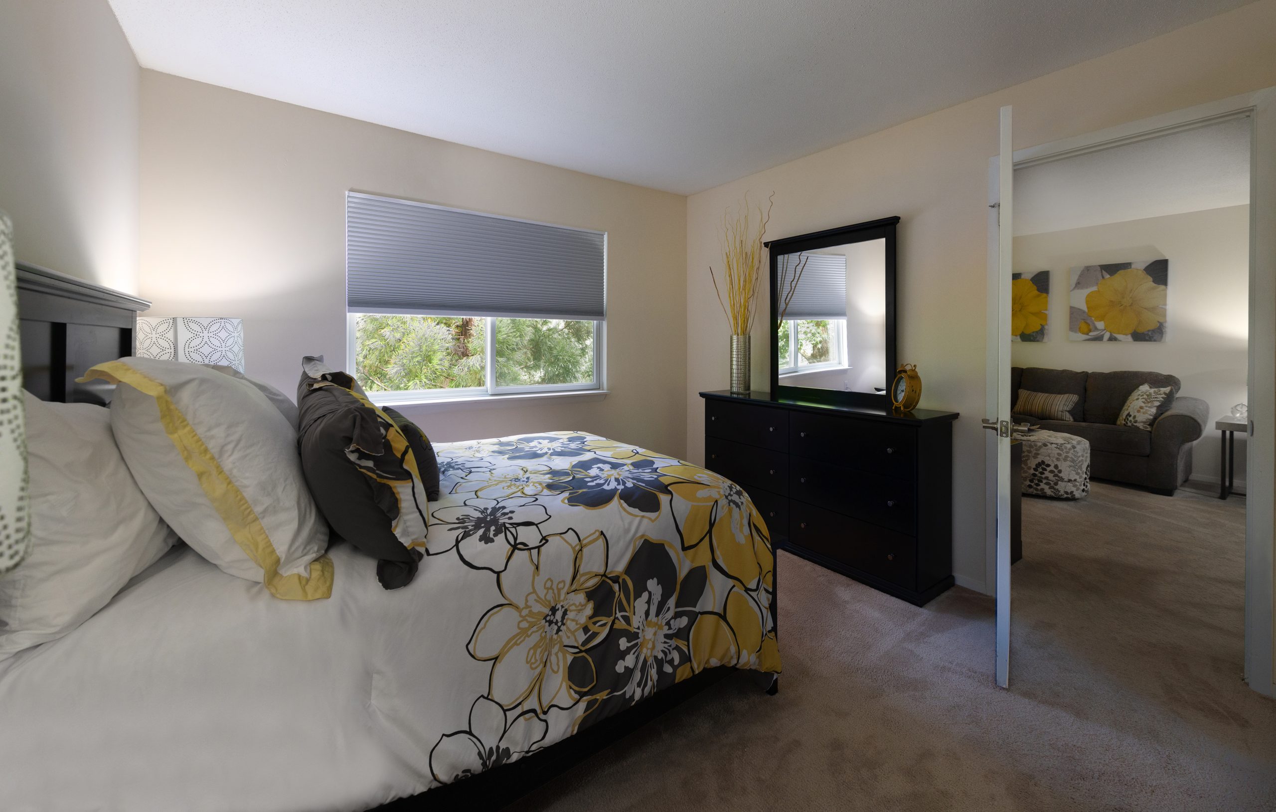 Cozy private room with floral bedding and natural light