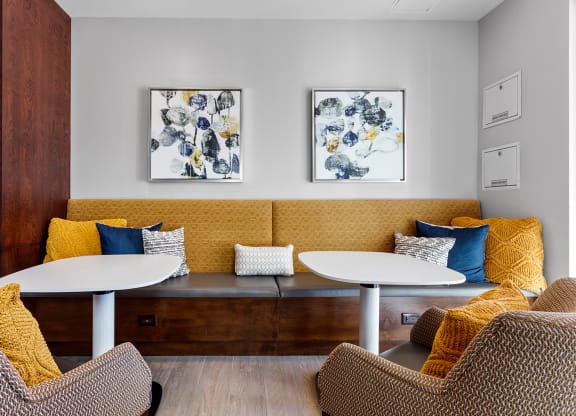 Bright common area with comfortable seating and artwork