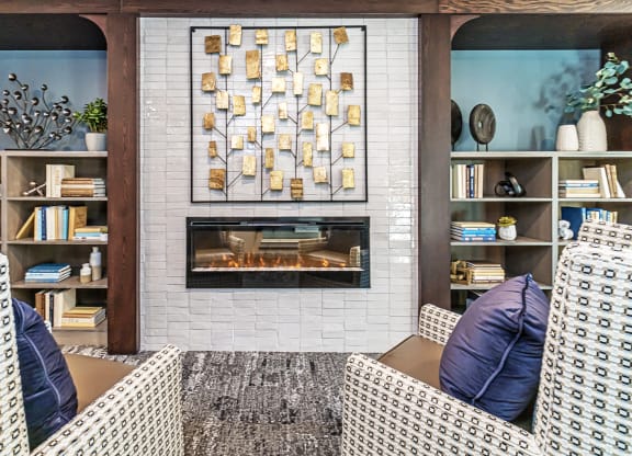 Cozy lounge area with fireplace and artwork