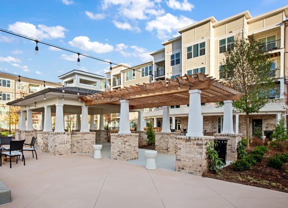 Outdoor patio area with seating and building backdrop