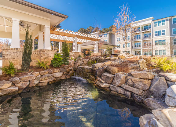 Beautiful outdoor pond area with natural landscaping