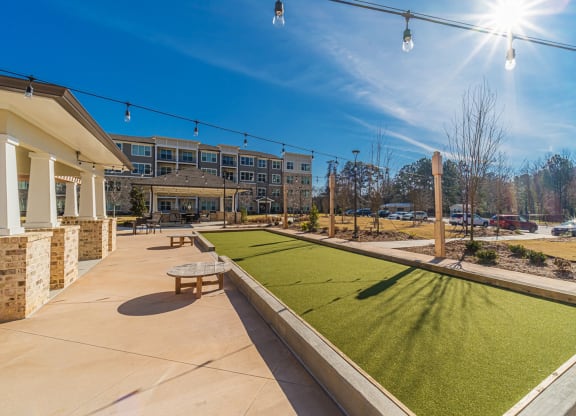 Outdoor recreational space with bocce ball court