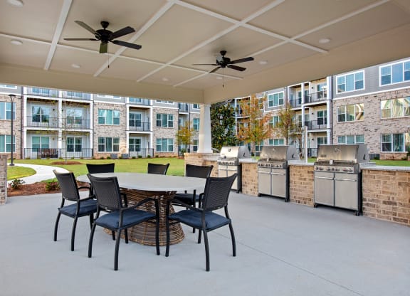 Covered outdoor grilling area with seating
