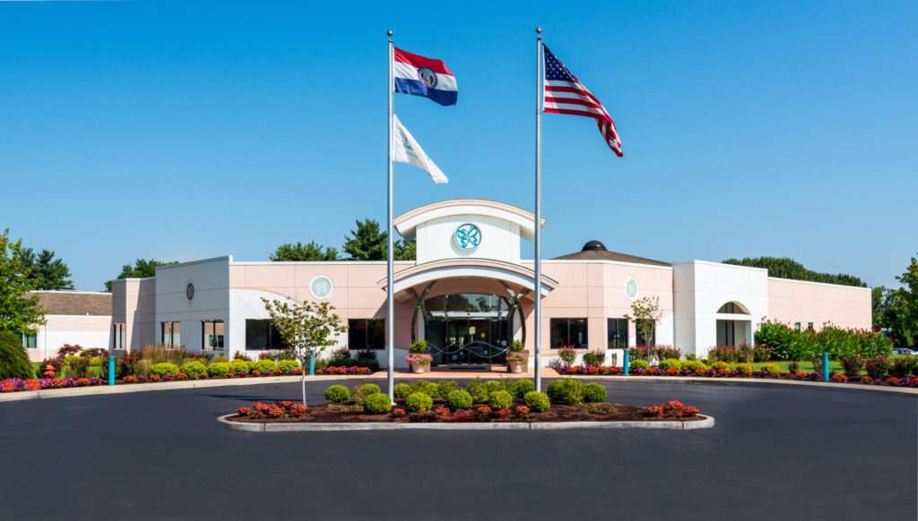 Exterior view of Delmar Gardens nursing home entrance
