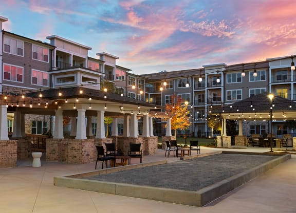 Outdoor patio area with seating and landscaping