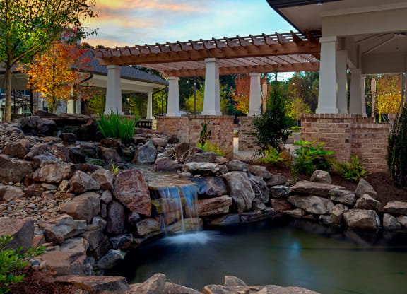 Tranquil outdoor space with a pond and waterfall