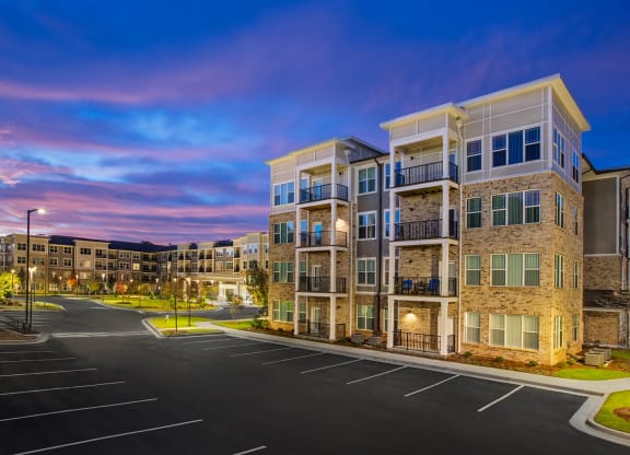 Exterior view of a senior living facility at dusk