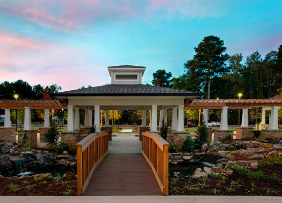Outdoor view of the facility entrance with a bridge