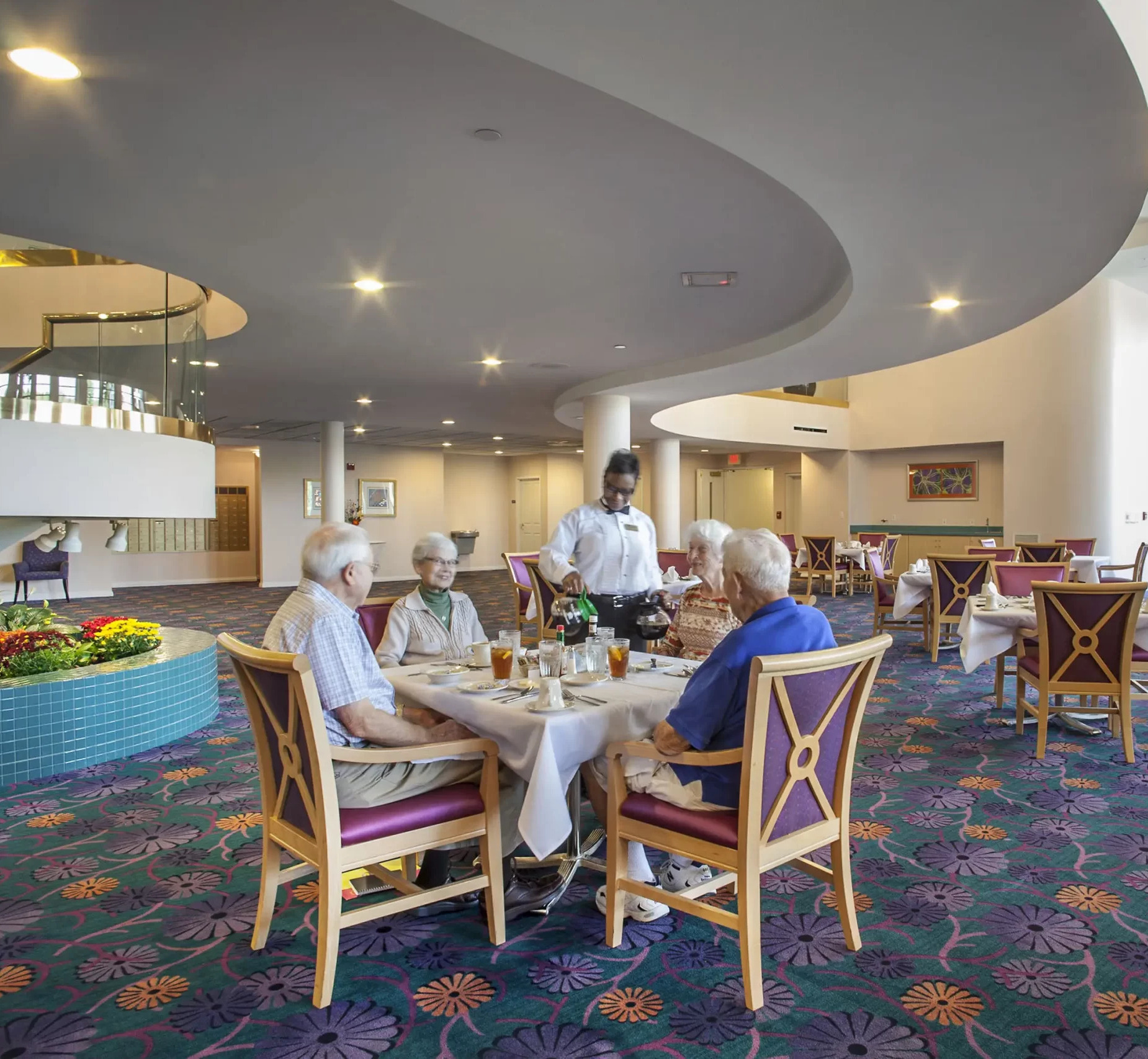 Residents enjoying a meal in the dining room