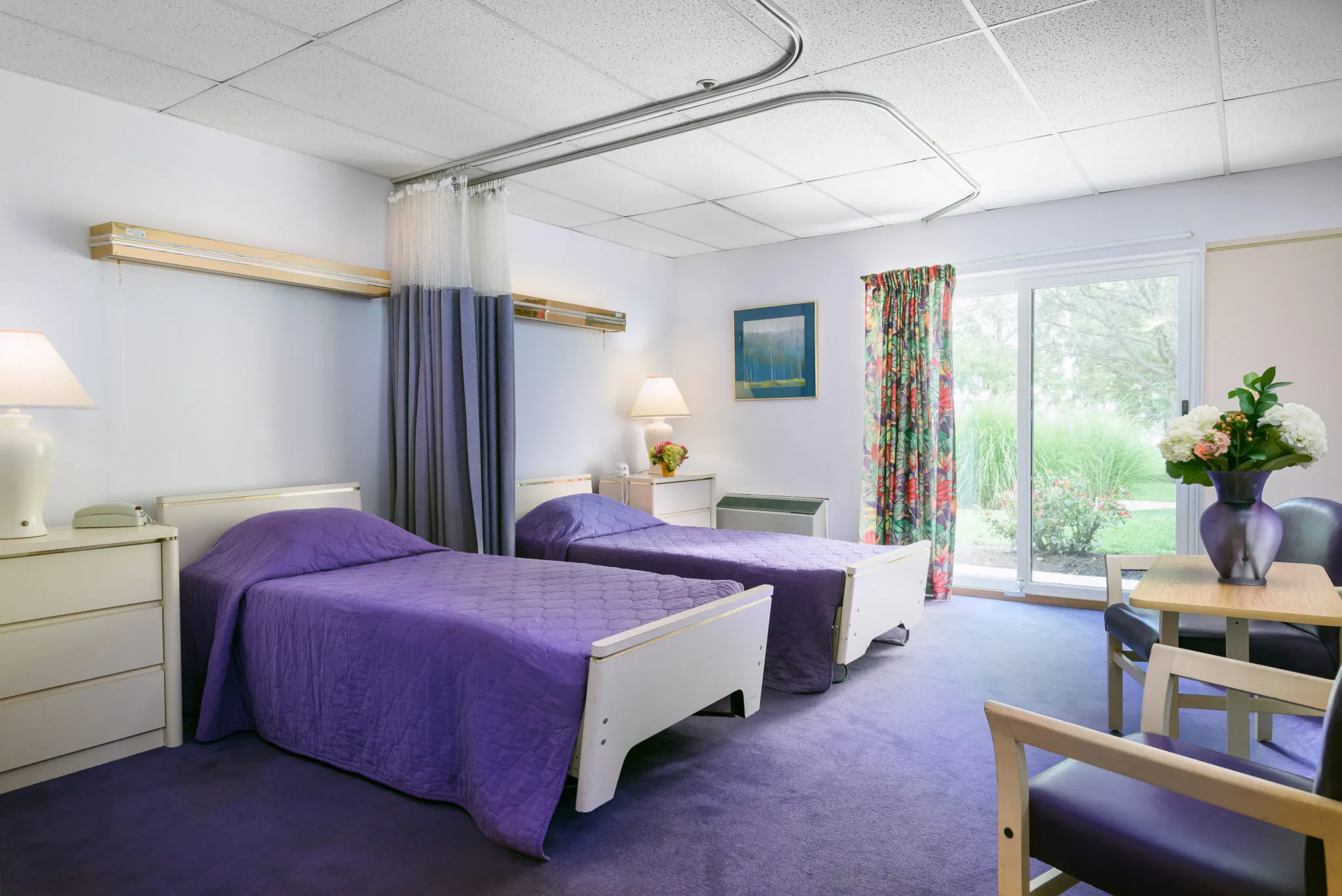 Bright interior view of a resident room with twin beds