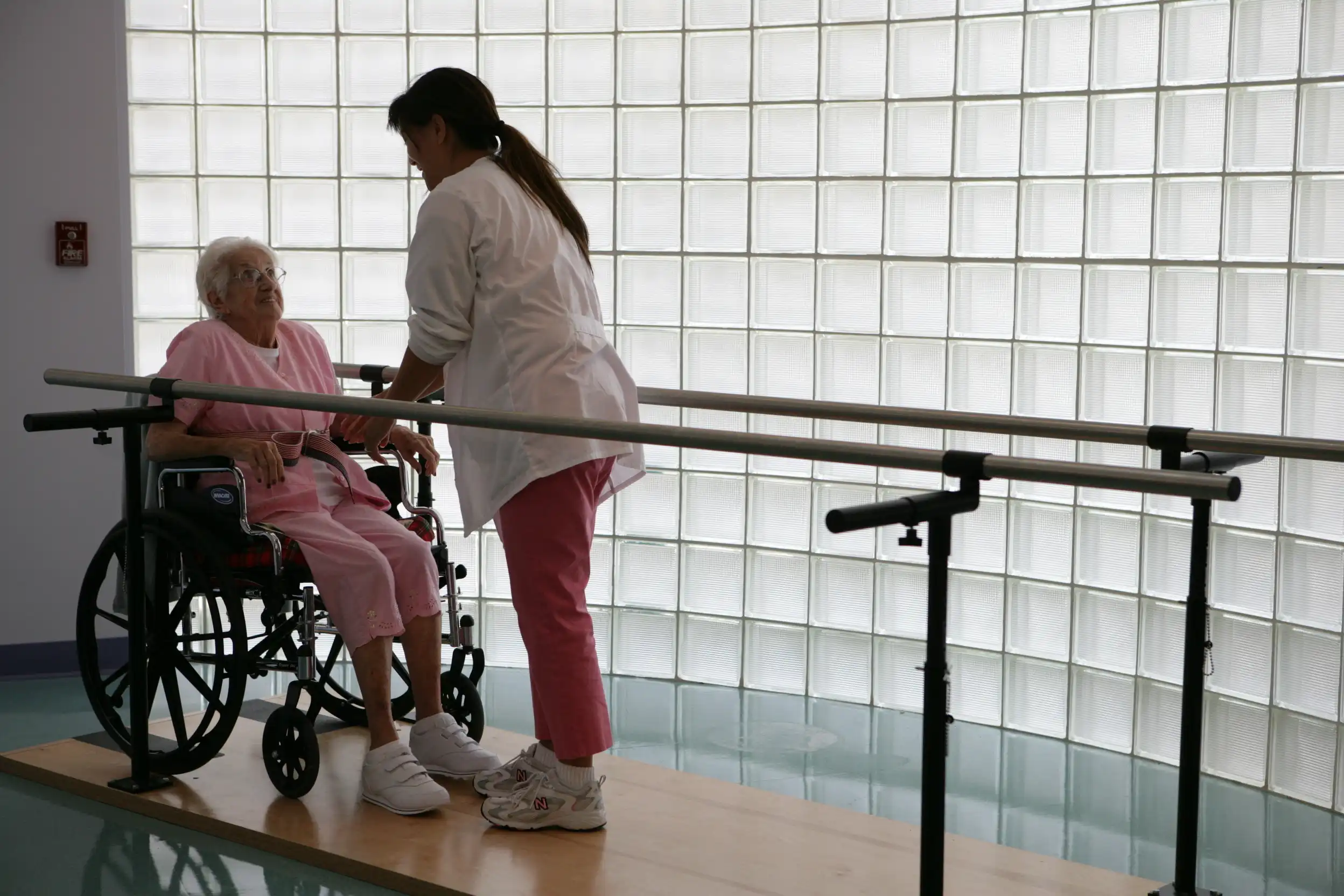 Therapist assisting a resident during rehabilitation