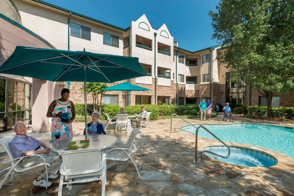 Residents enjoying the outdoor pool area