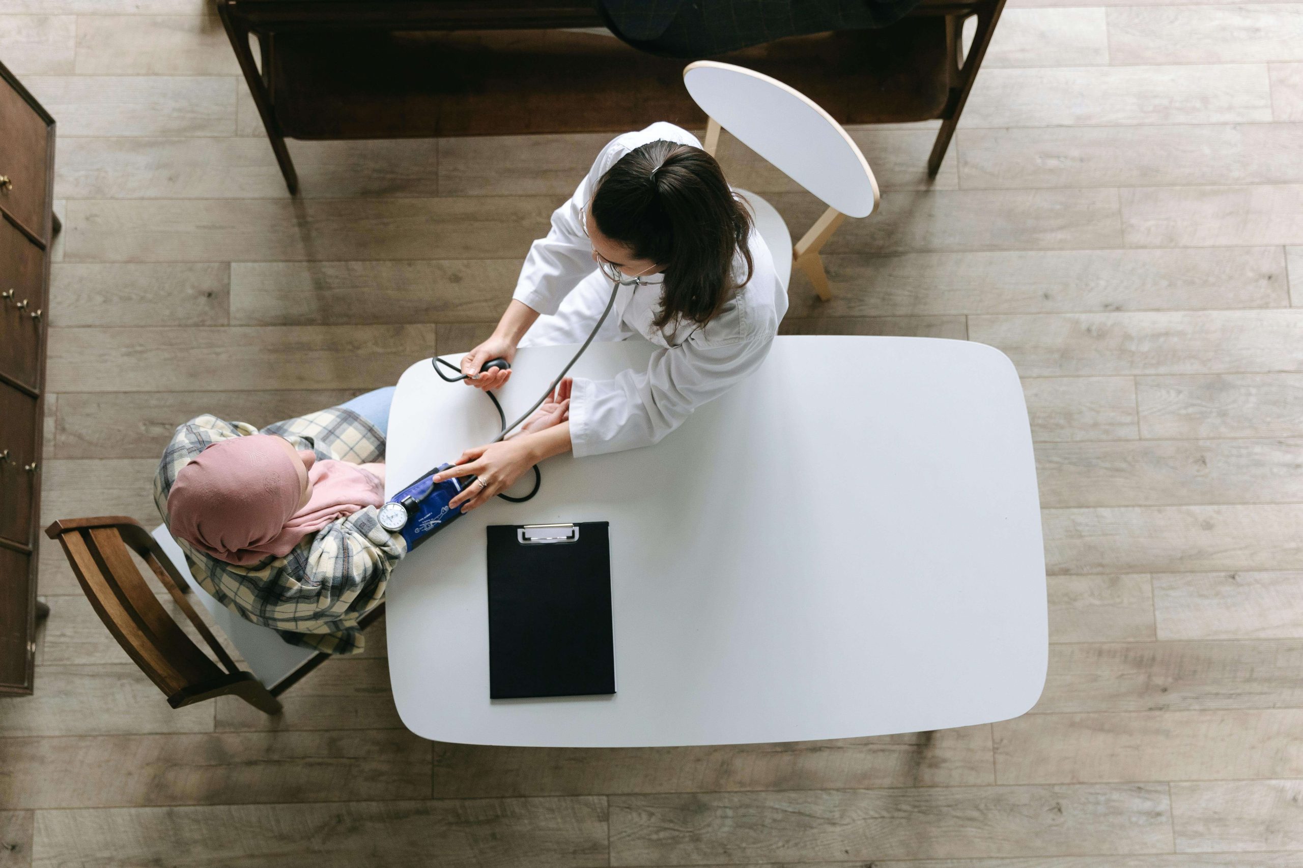 A healthcare professional checking a patient's blood pressure