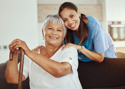 Smiling caregiver and resident in a comfortable indoor setting.