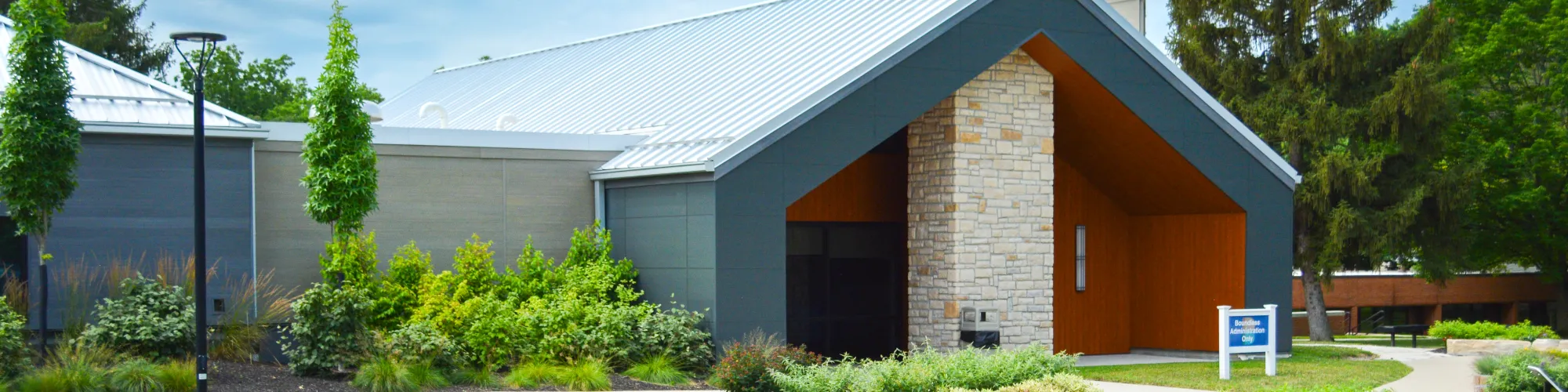 Exterior view of Koinonia Homes building and landscaping.