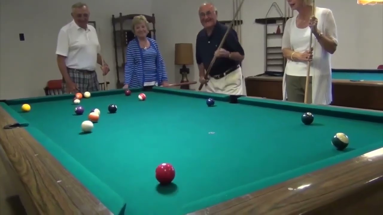 Residents enjoying a game of billiards.
