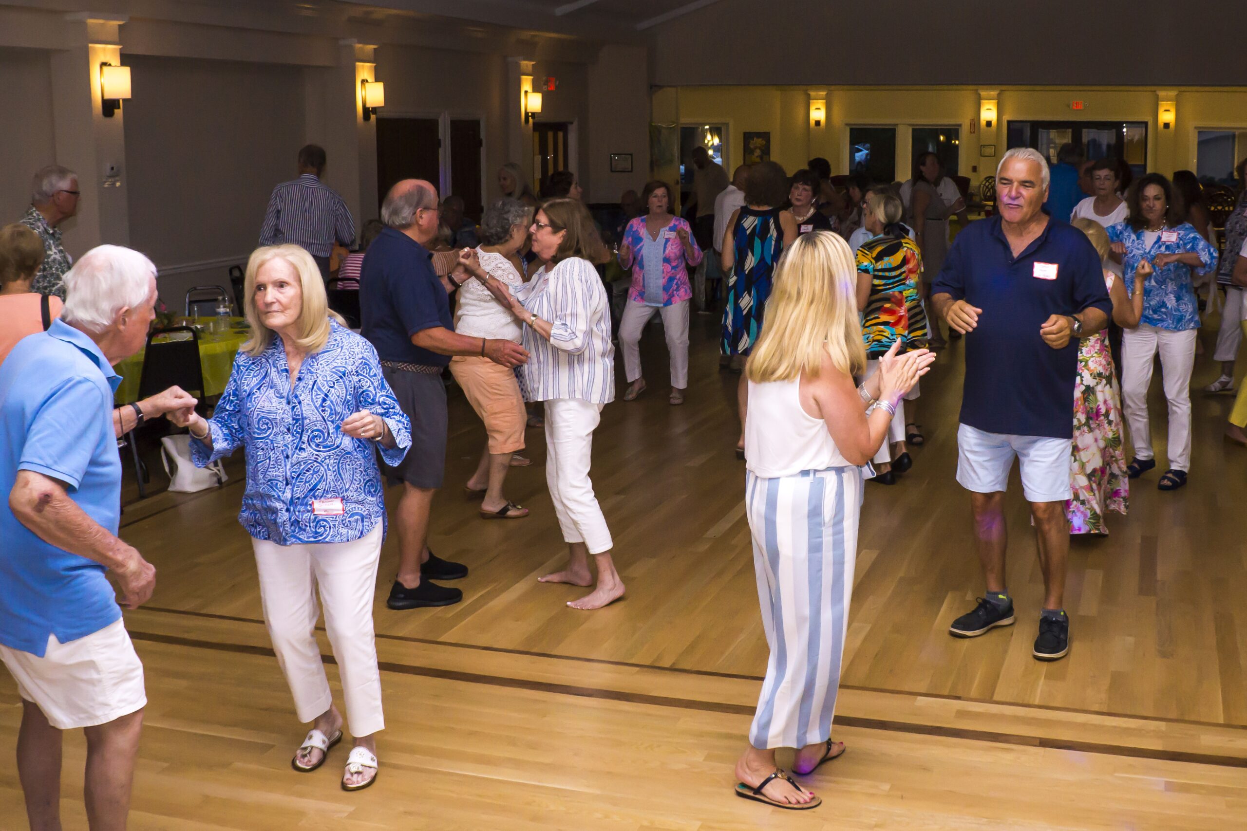 Residents enjoying a dance party in the activity room.