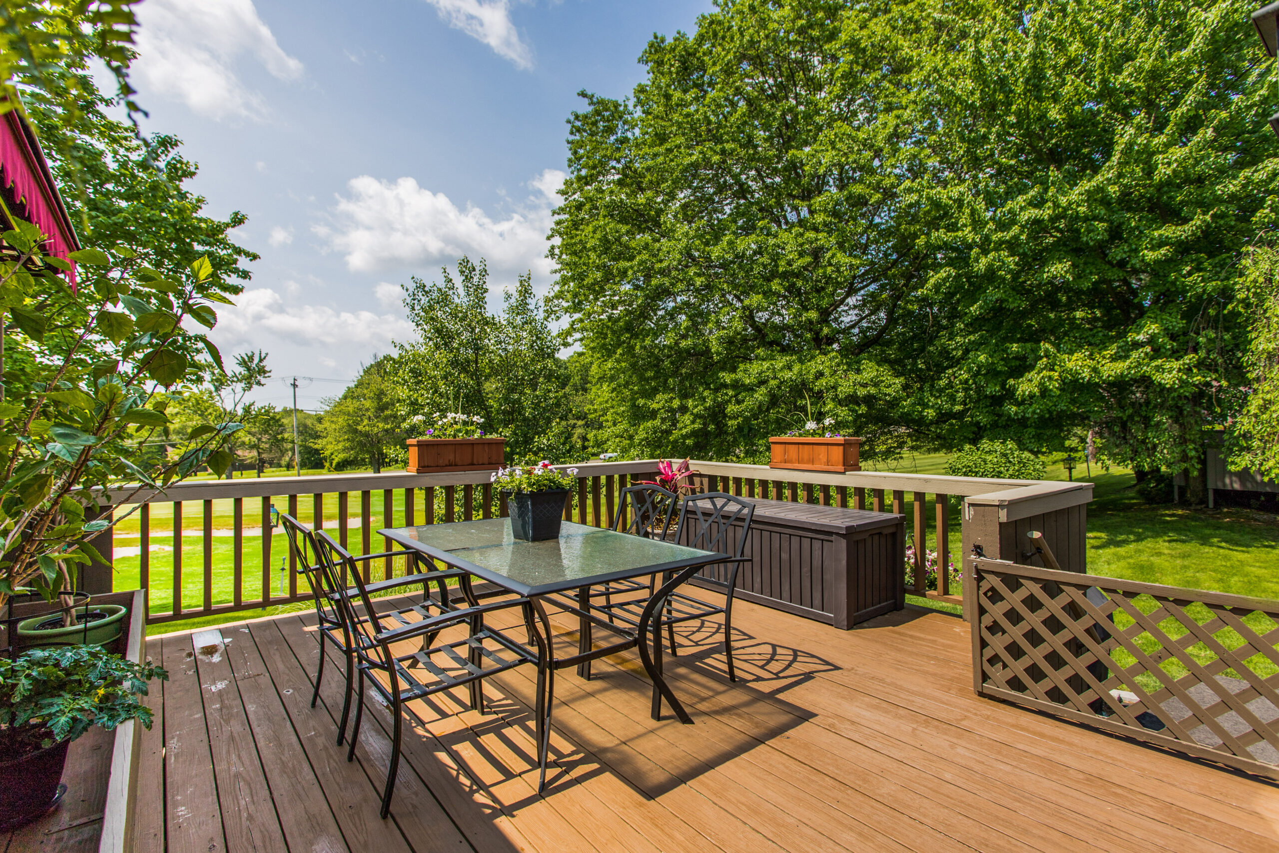 Outdoor patio area with seating and plants