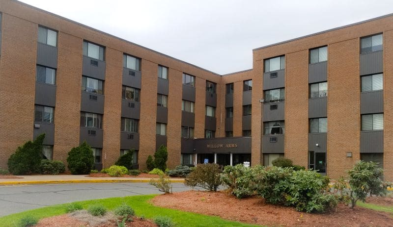 Exterior view of Willow Arms Apartments building