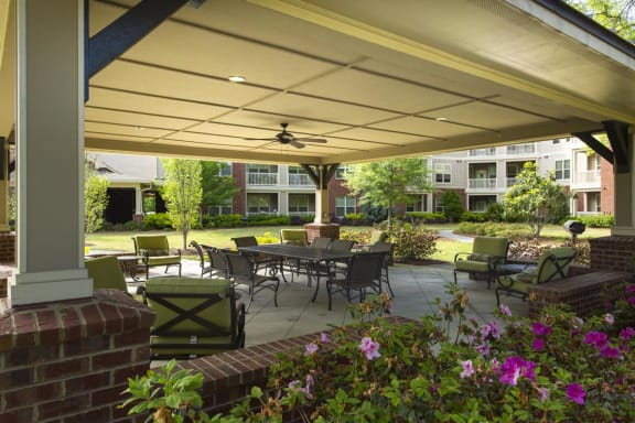 Outdoor seating area with tables and flowers
