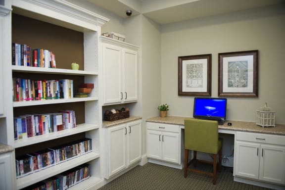 Cozy interior space with bookshelves and a computer