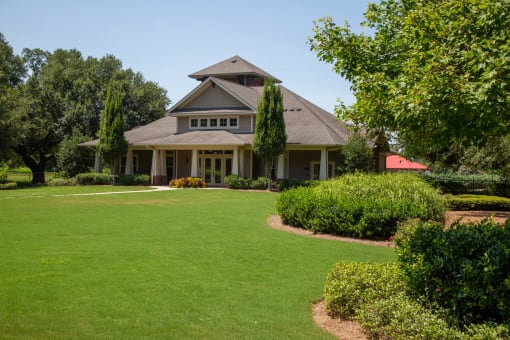 Exterior view of a facility surrounded by greenery.