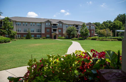 Exterior view of the facility with landscaped grounds