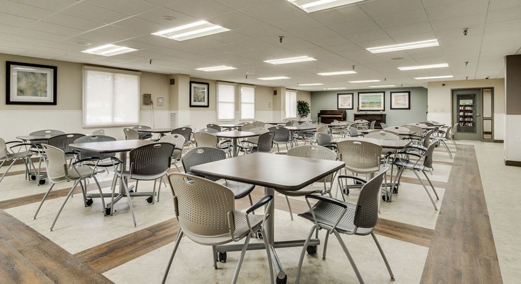 Empty common area with tables and chairs