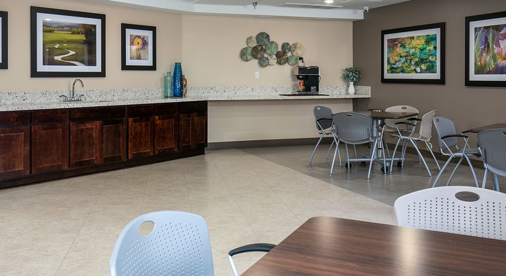 Bright common area with seating and decor.