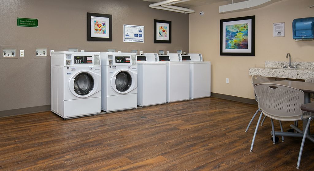 Laundry room with commercial washers and dryers