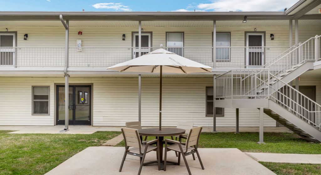 Outdoor seating area with table and umbrella