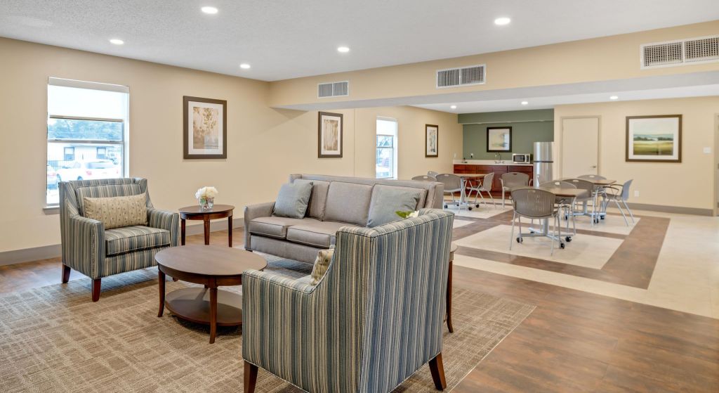 Common area with seating and tables for residents