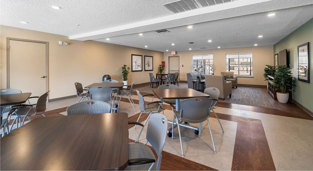 Modern common area with tables and seating.