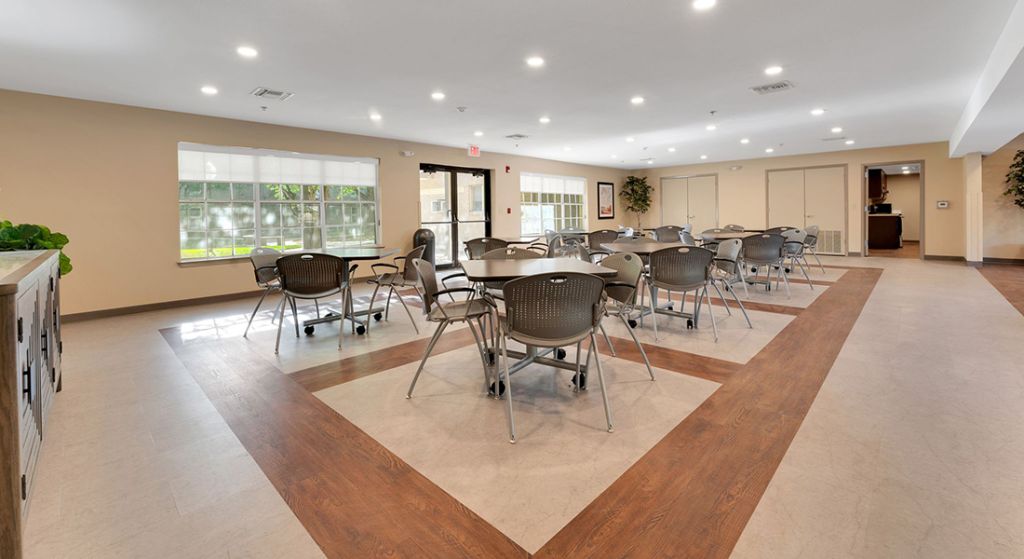 Bright common area with chairs and tables