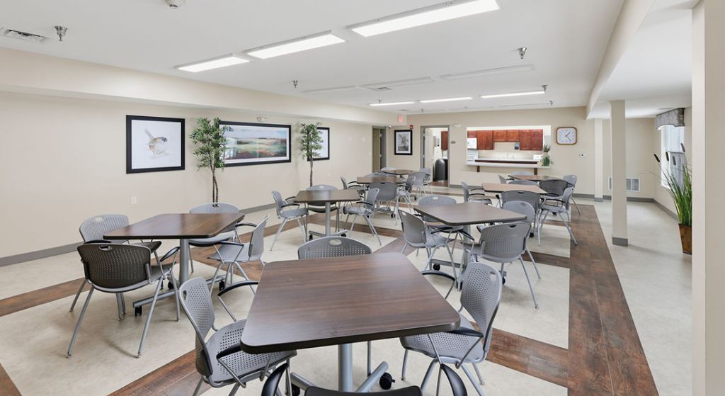 Bright dining area with tables and chairs