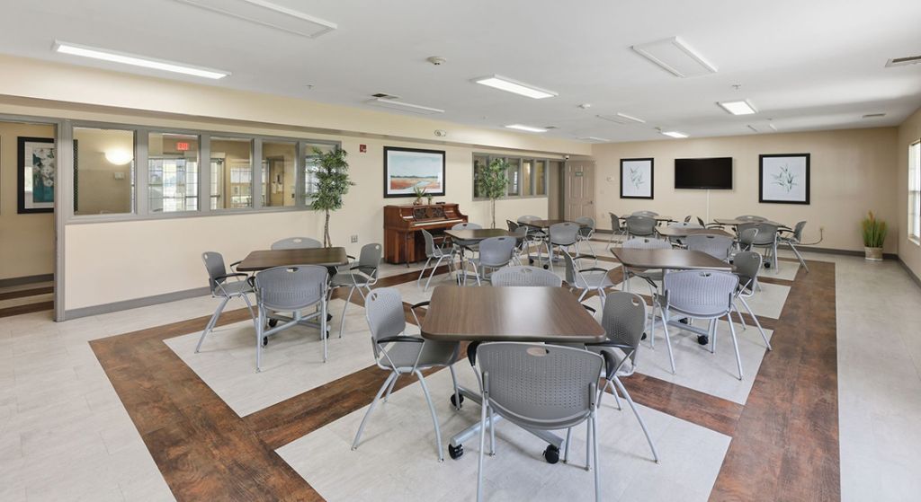 Spacious common area with tables and chairs