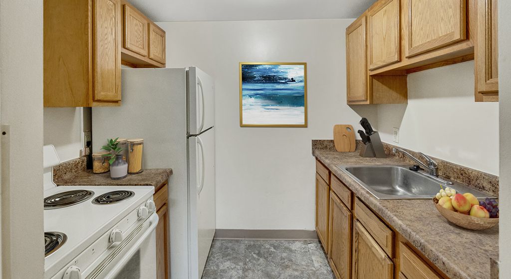Clean kitchen space with cabinets and appliances.