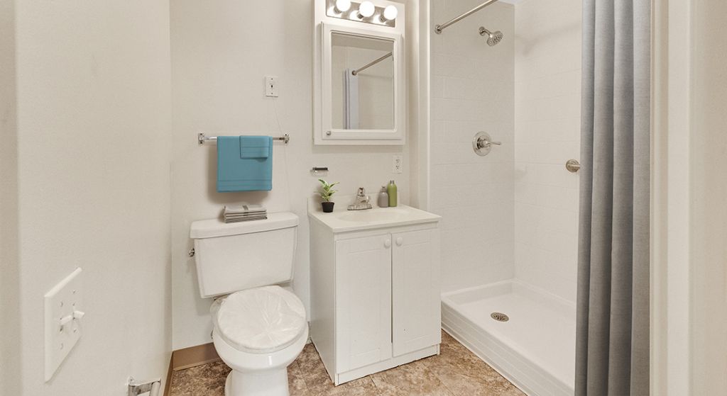 Clean bathroom with a shower and amenities.
