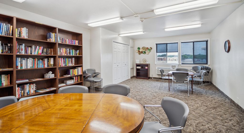 Common area with bookshelves and seating
