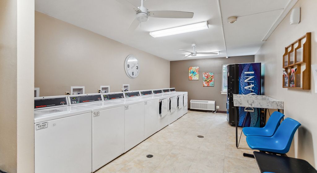 Laundry room with washing machines and equipment
