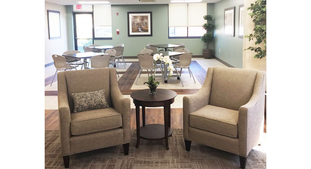 Cozy common area with chairs and dining space.