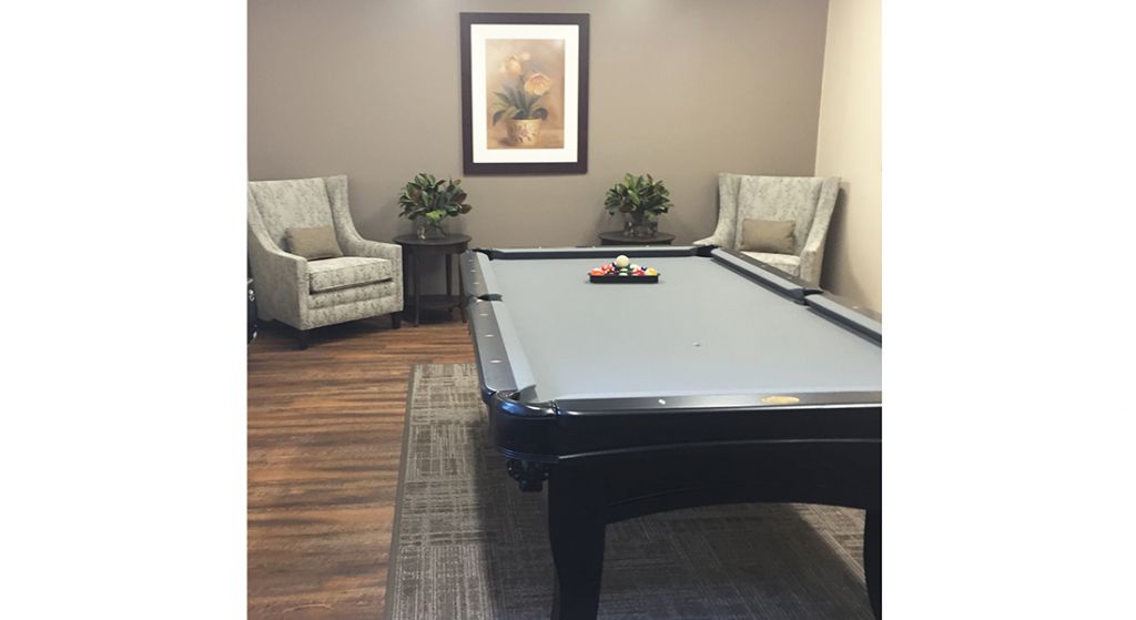 Common area with a pool table and seating