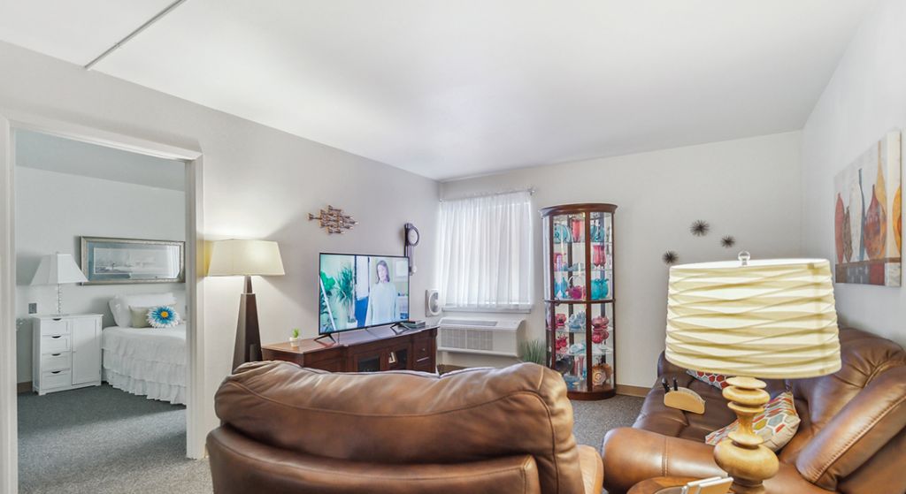 Cozy lounge area with seating and a TV