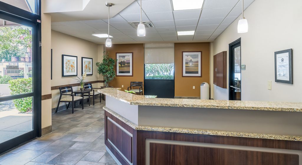 Reception area with seating and artwork.