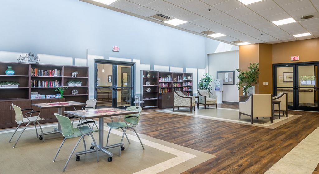 Bright common area with bookshelves and seating