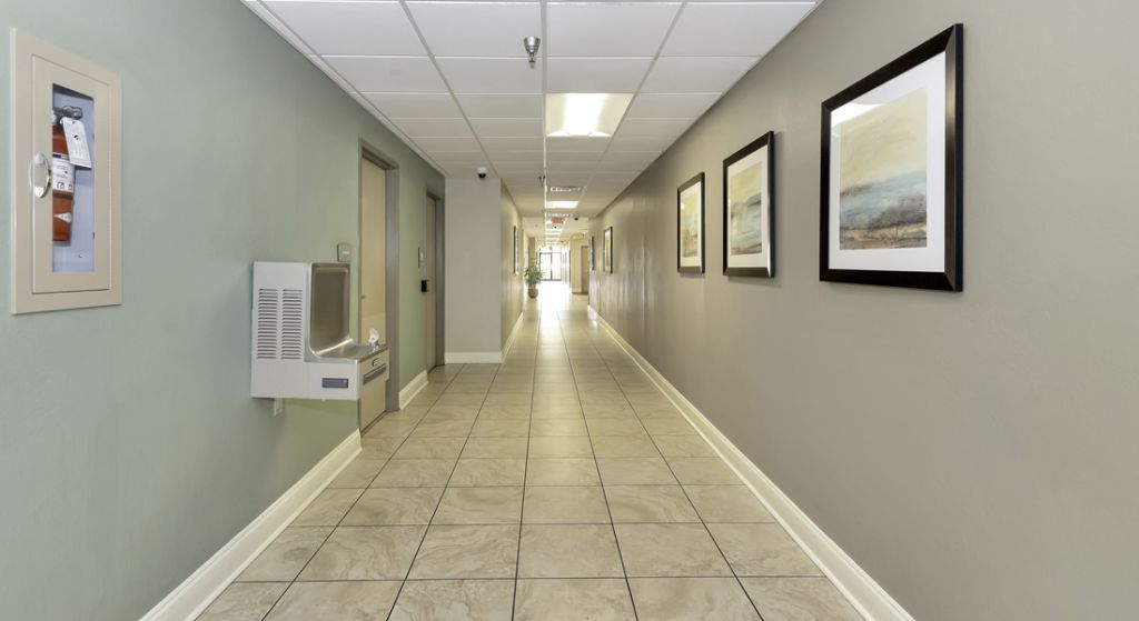 Hallway with artwork and water fountain