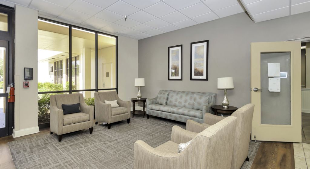 Common area with comfortable seating and large windows